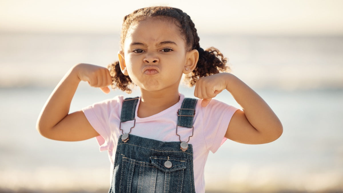 Girls in sports - Girl flexing muscles